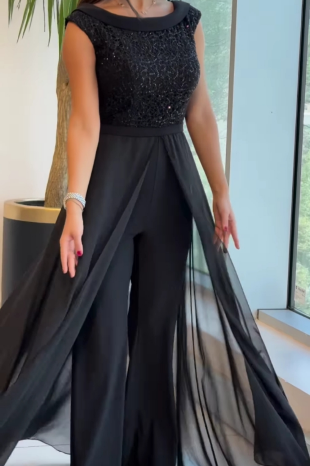 Zwarte jumpsuit met glittertop