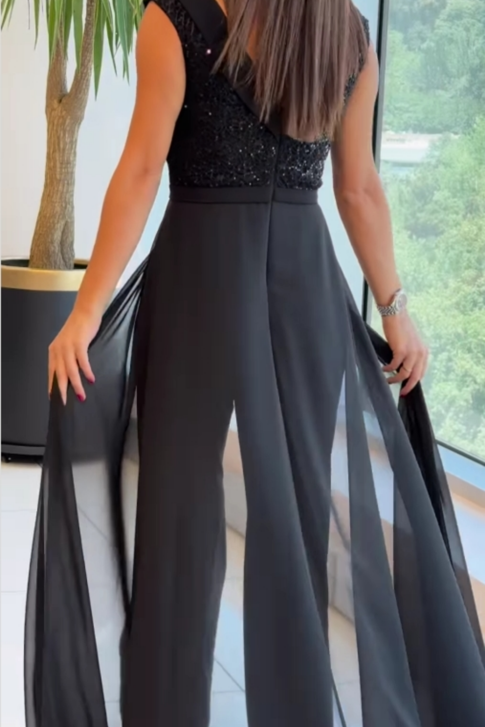 Zwarte jumpsuit met glittertop