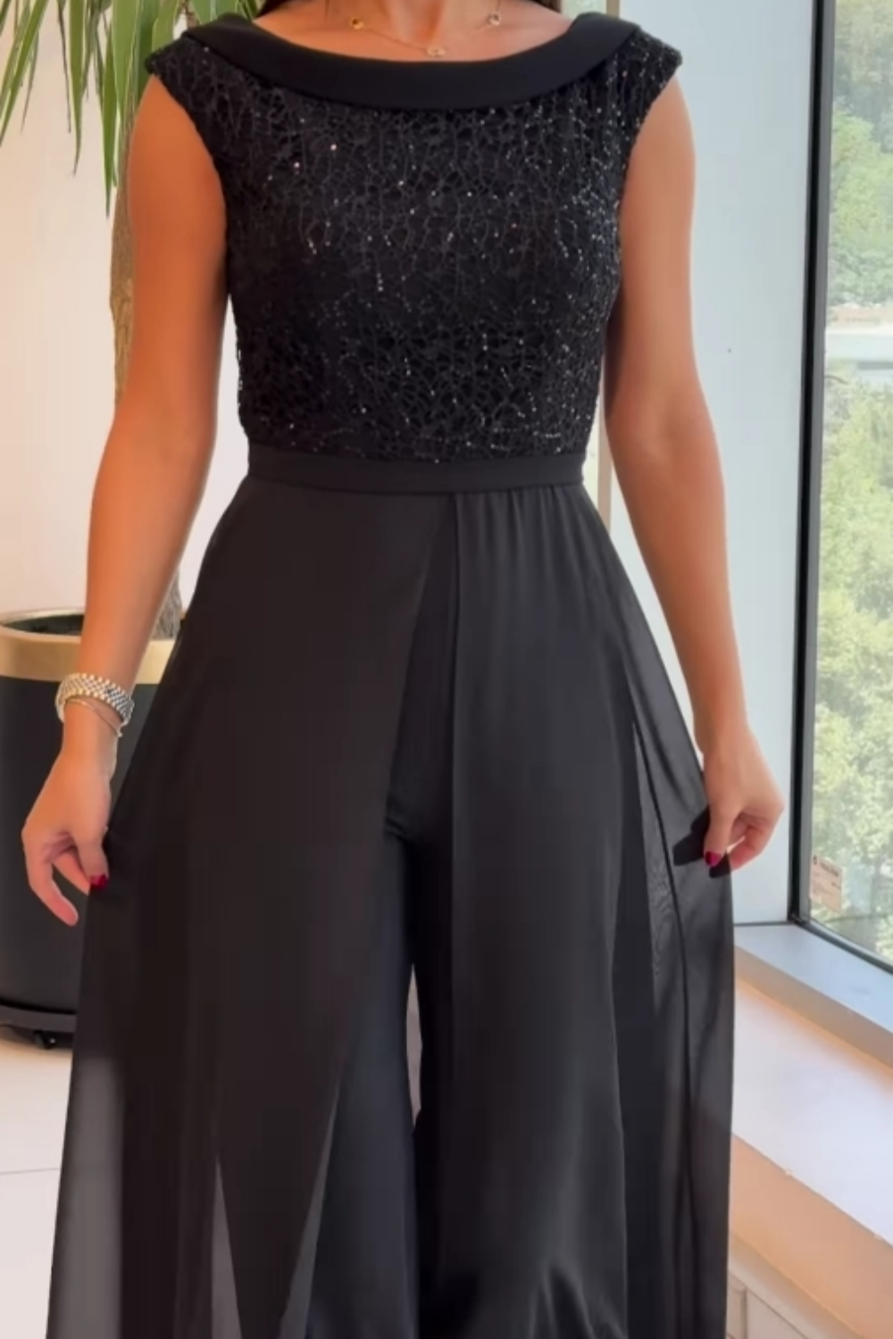 Zwarte jumpsuit met glittertop